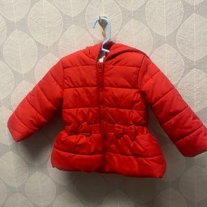 Red puffer coat